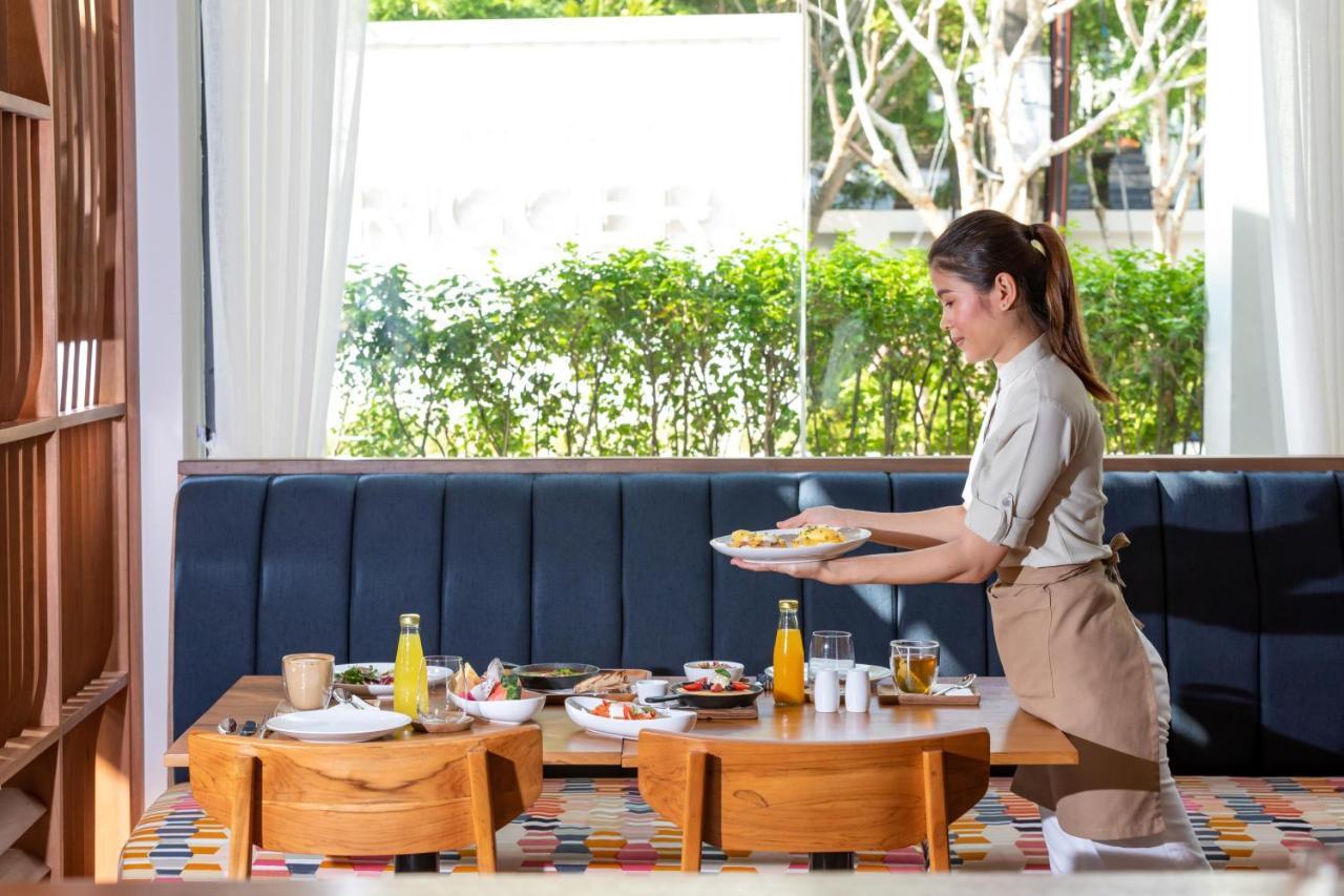 Outrigger Surin Beach Resort - Sha Extra Plus Exterior foto A Thai waitress serving food
